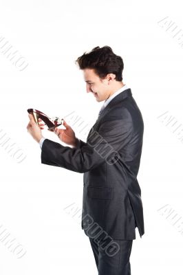 Young businessman with women's shoes