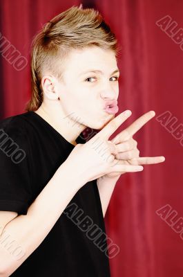 teenager in a black vest