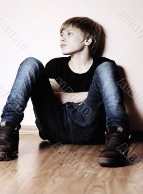 The teenager near a wall