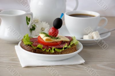 Sandwich with a cup of coffee and milk