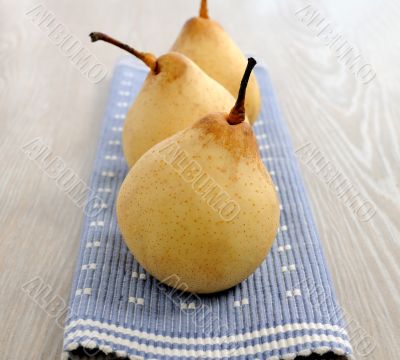 Three ripe yellow pear 