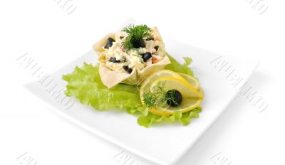 Salad with crab meat in a basket