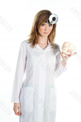 Female doctor with a human skull in his hands
