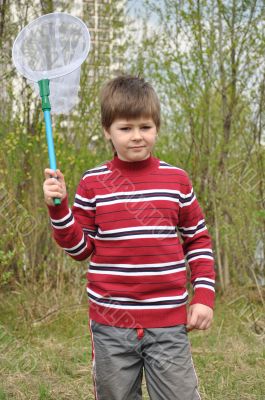 Boy with a butterfly net for catching butterflies