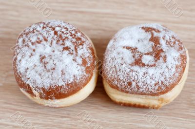 Donuts sprinkled with powdered sugar