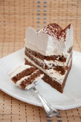 A piece of chocolate cake with cream
