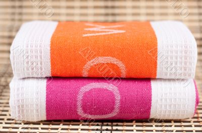 Two kitchen towels with the letters