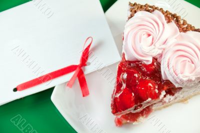a piece of delicious cake and paper for text