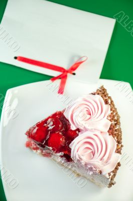 a piece of delicious cake and paper for text