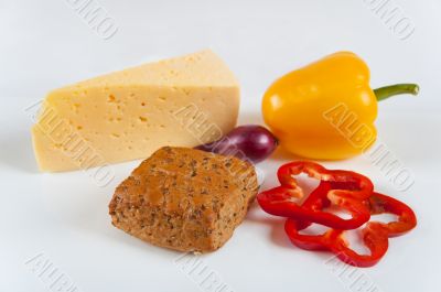 The concept of healthy food - bread with bran, vegetables and cheese on a light background