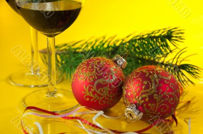 New Year`s still life - glasses of wine and Christmas balls