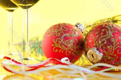 New Year`s still life - glasses of wine and Christmas balls
