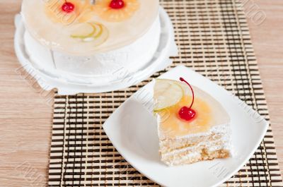 Fruit cake with cherries, pineapple and apple.