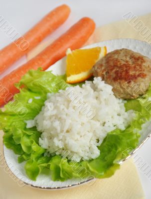 Home cooking, cutlet with rice and vegetables
