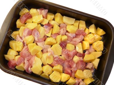 Meat and potatoes in trays, isolated on a white background 