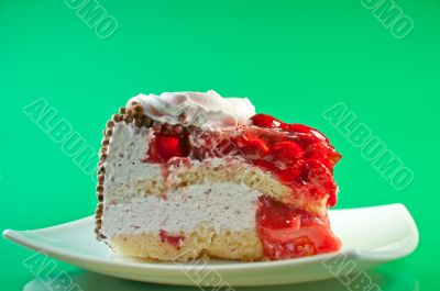 delicious slice of cake with cream and fresh berries