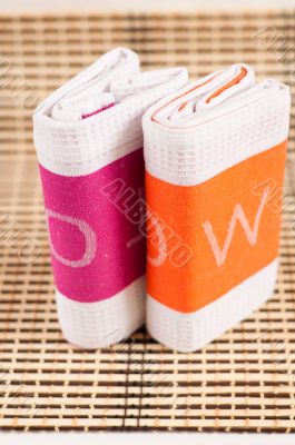 Two kitchen towels with the letters