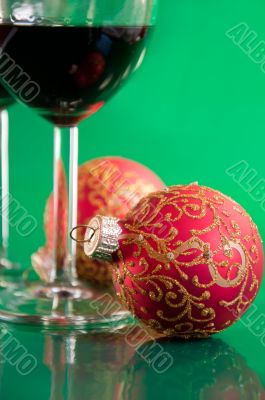 New Year`s still life - glasses of wine and Christmas balls