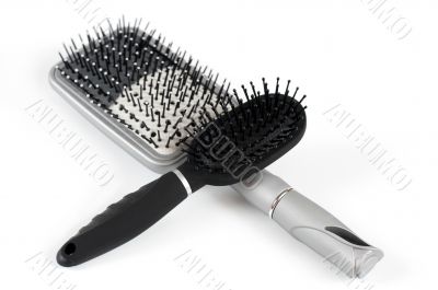 Two massage hairbrush on a light background
