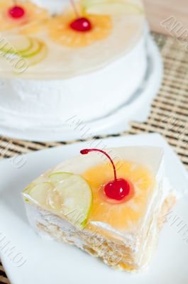 Fruit cake with cherries, pineapple and apple.
