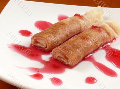 Delicious homemade pancakes with raspberry jam