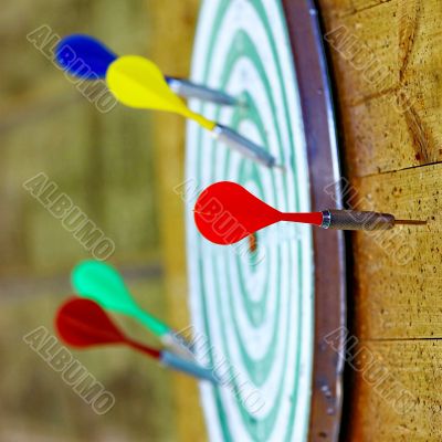  Colorful darts on dartboard