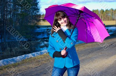 Woman with umbrella smiling