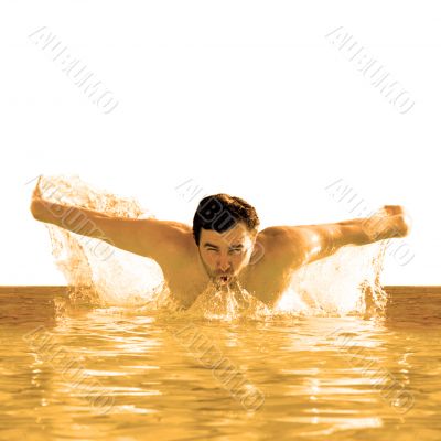 man swims butterfly in pool