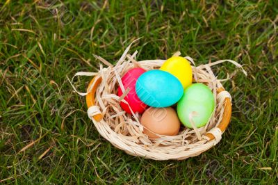 Basket with the colorful Easter eggs