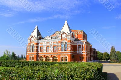 Landscape with historic theater and blue sky