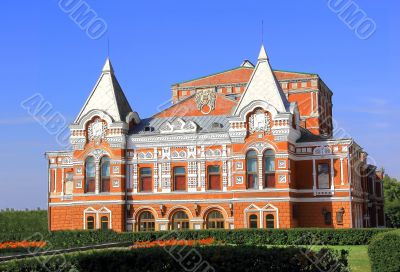 Landscape with historic theater and blue sky