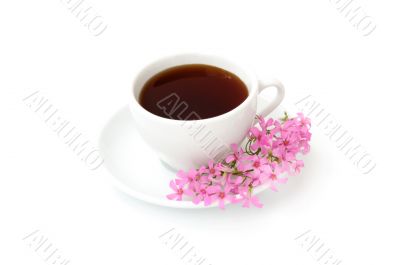 A cup of black coffee with flowers
