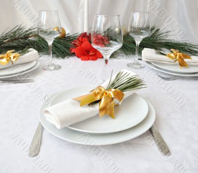 Coordinated decorative napkin on a plate with cutlery