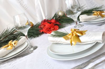    Coordinated decorative napkin on a plate with cutlery