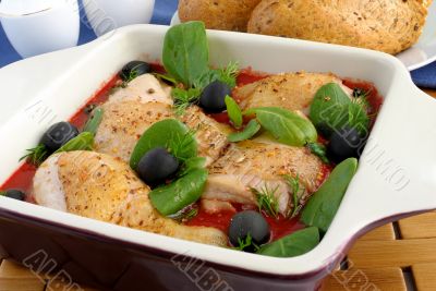 Pieces of chicken in tomato sauce