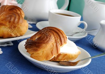 Eclairs with a cup of coffee