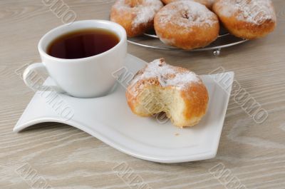 A cup of coffee and donuts