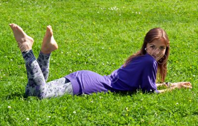 girl lying on grass