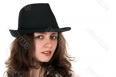 portrait of a beautiful brunette in a hat