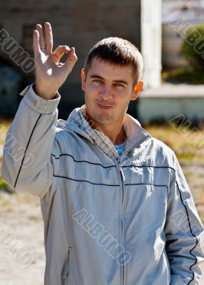 man shows Okay 