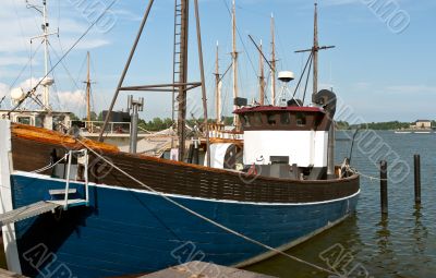 Wooden blue boat in the port