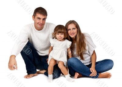 happy family sitting in the studio