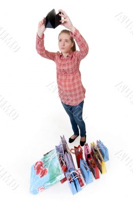 girl looks into an empty wallet