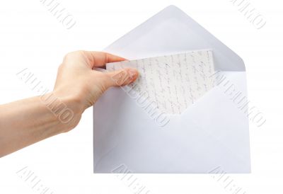 female hand holding an envelope