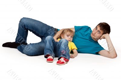 dad and little daughter lying on the floor