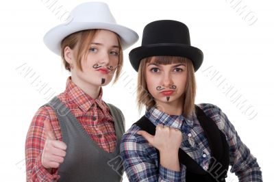 Two girls with painted mustaches