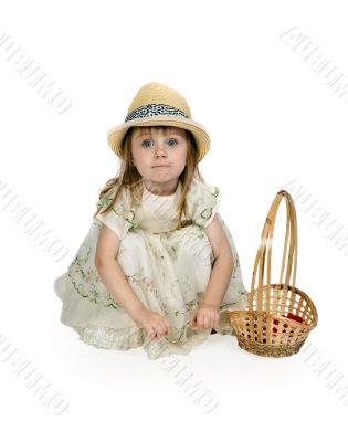 little girl in a straw hat with a basket