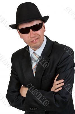 businessman in dark glasses and a hat