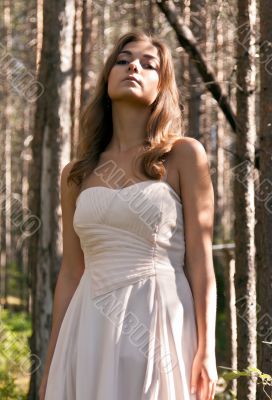 girl in a dress in a forest