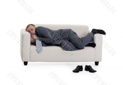 businessman sleeping on a sofa